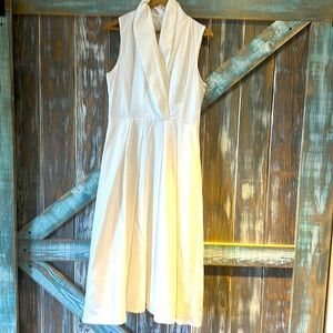 Beautiful white sleeveless dress, nice and flowy bottom, v cut chest